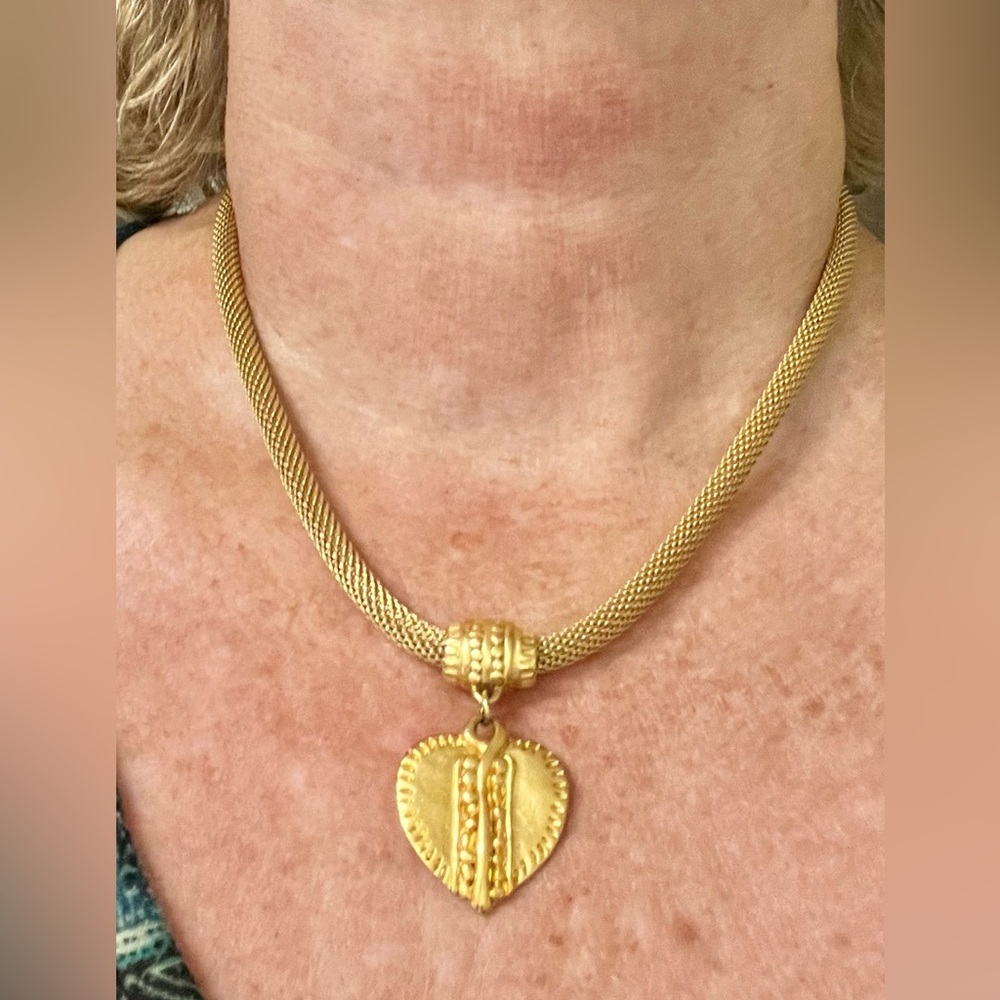 Costume gold chain with heart pendant.